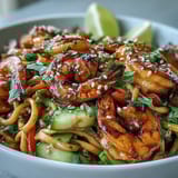 A close-up of the 15-Minute Asian Noodle Bowl With Grilled Shrimp highlighting colorful veggies and sesame seeds.
