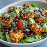 Freshly prepared taco salad with sweet corn and zesty lime dressing.