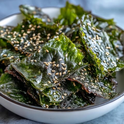 Crispy seaweed snack chips with sesame and salt, a healthy baked savory treat.