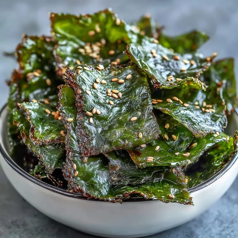 Delicious seaweed snack chips drizzled in sesame oil, perfect for snacking.