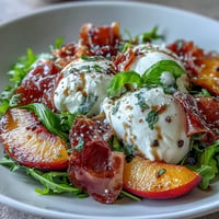 Creamy burrata and peaches star in a vibrant Burrata and Peach Summer Salad.